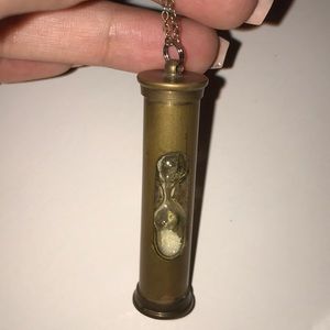 BCBG hourglass necklace with flowing sand inside